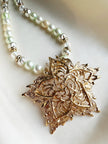 Grote vergulde designer broche