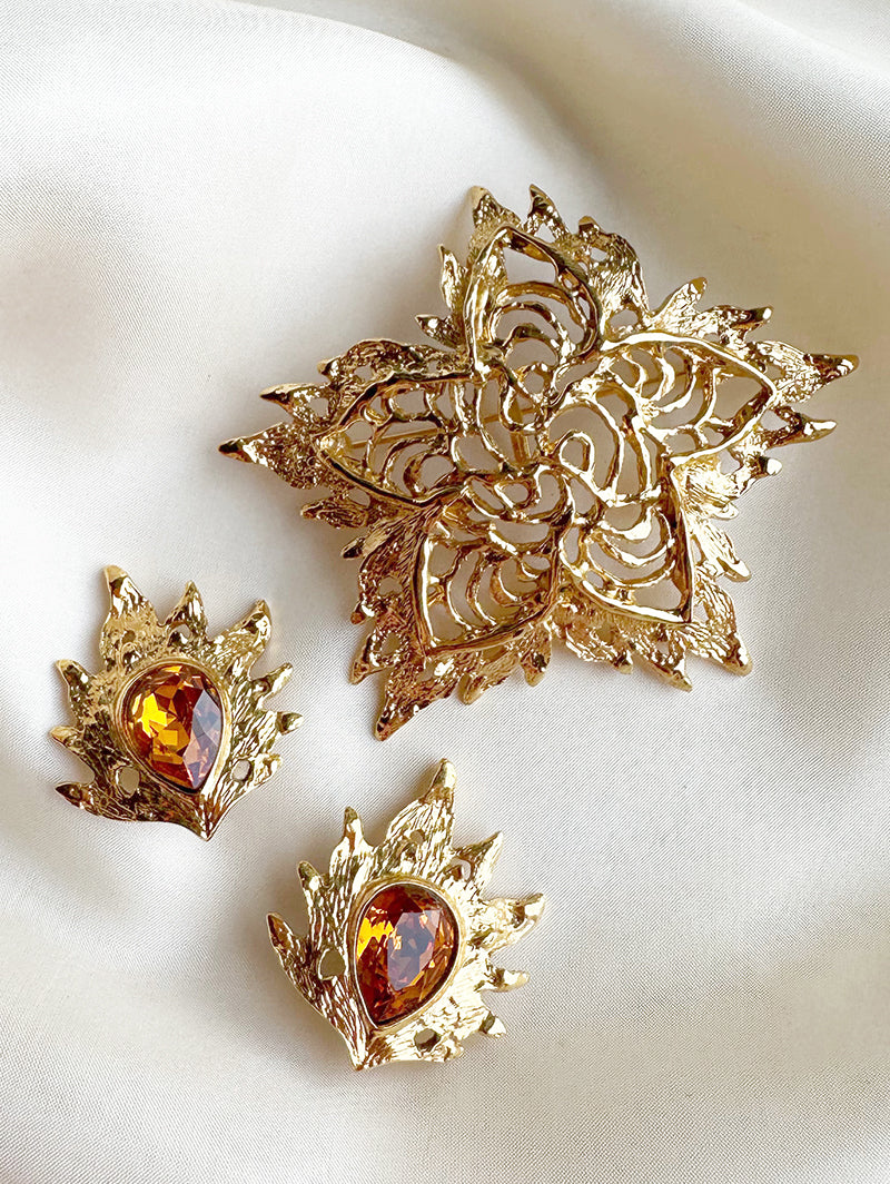 Grote vergulde designer broche