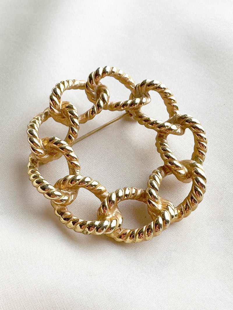 Vergulde ronde broche