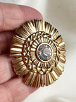 Vergulde designer broche