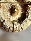 Vergulde designer broche