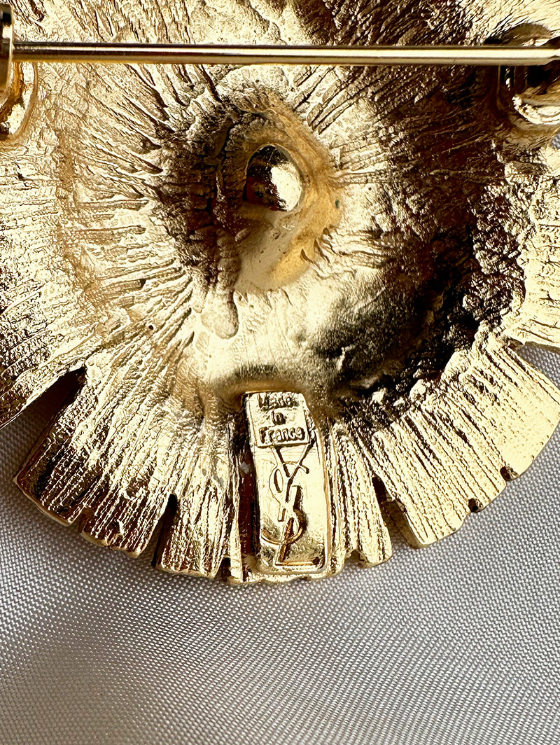 Vergulde designer broche