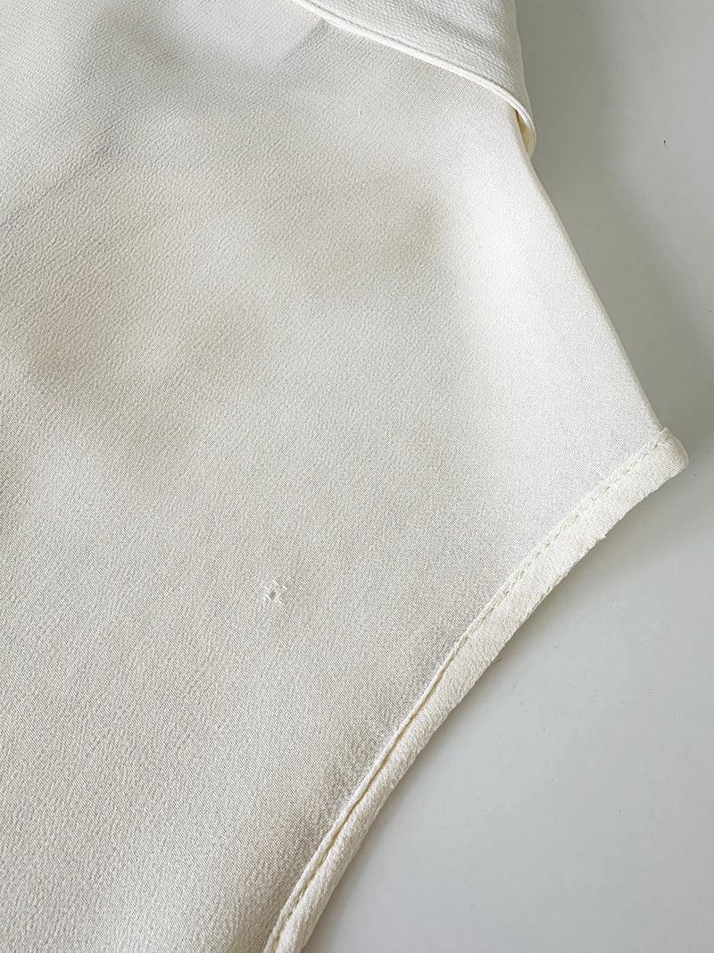 Witte designer roezeltop