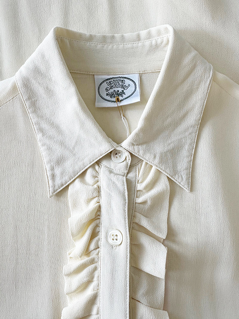 Witte designer roezeltop