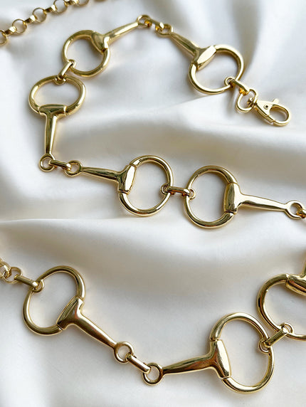 Gouden metalen horsebit ceintuur