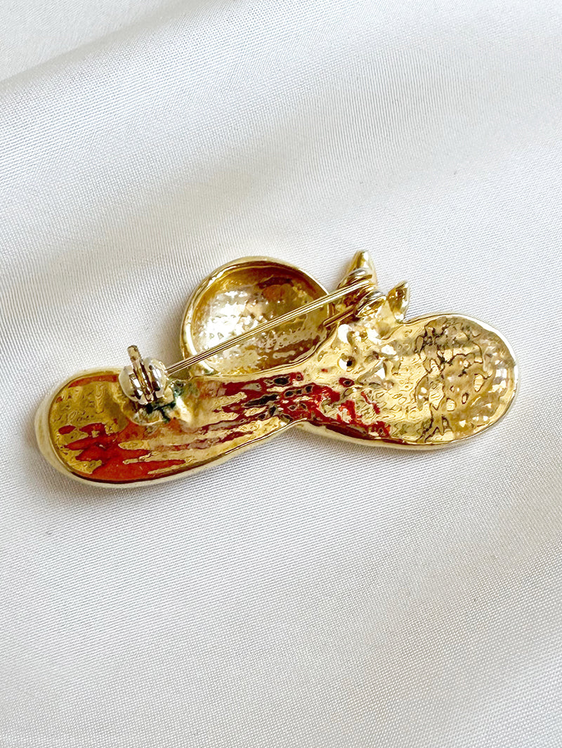 Zwart/gouden hoed broche