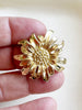 Gouden bloem broche