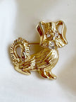Gouden hondje broche