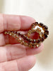 Bruine strass broche