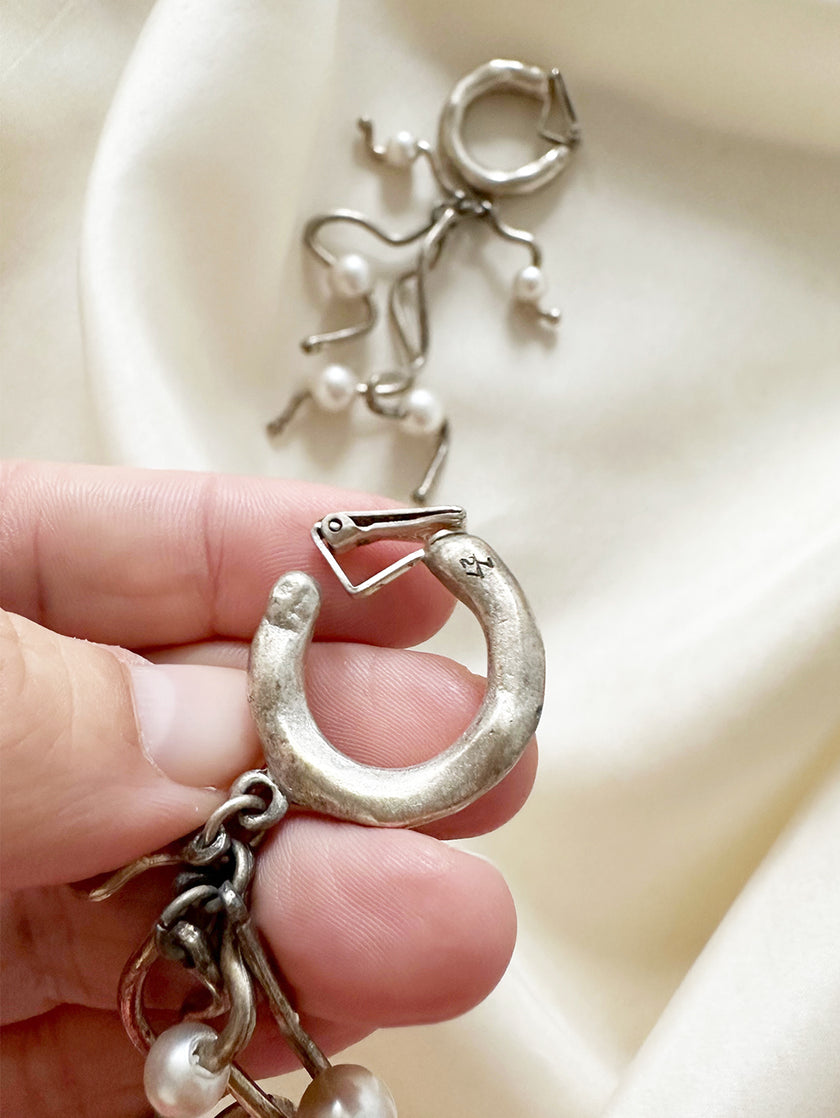 Verzilverde clip oorbellen met parels