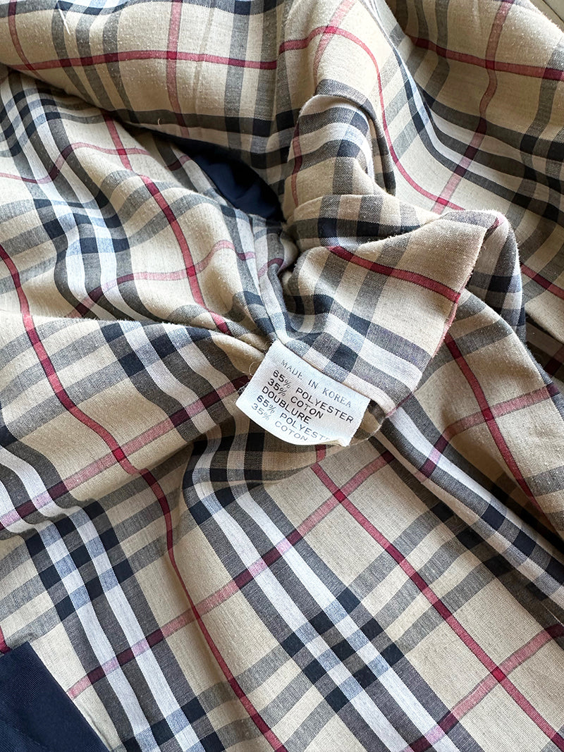 Donkerblauwe trenchcoat