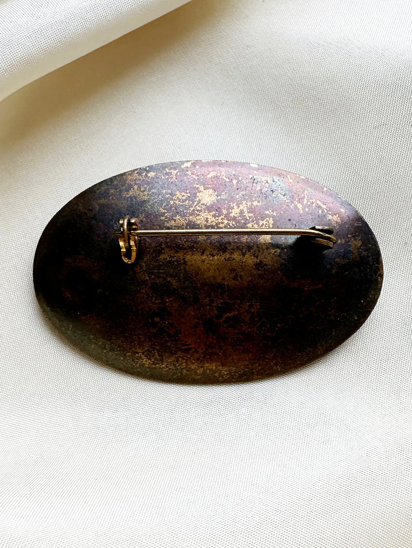 Koperen ovale broche