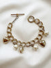 Gouden bedelarmband met hartjes en parels