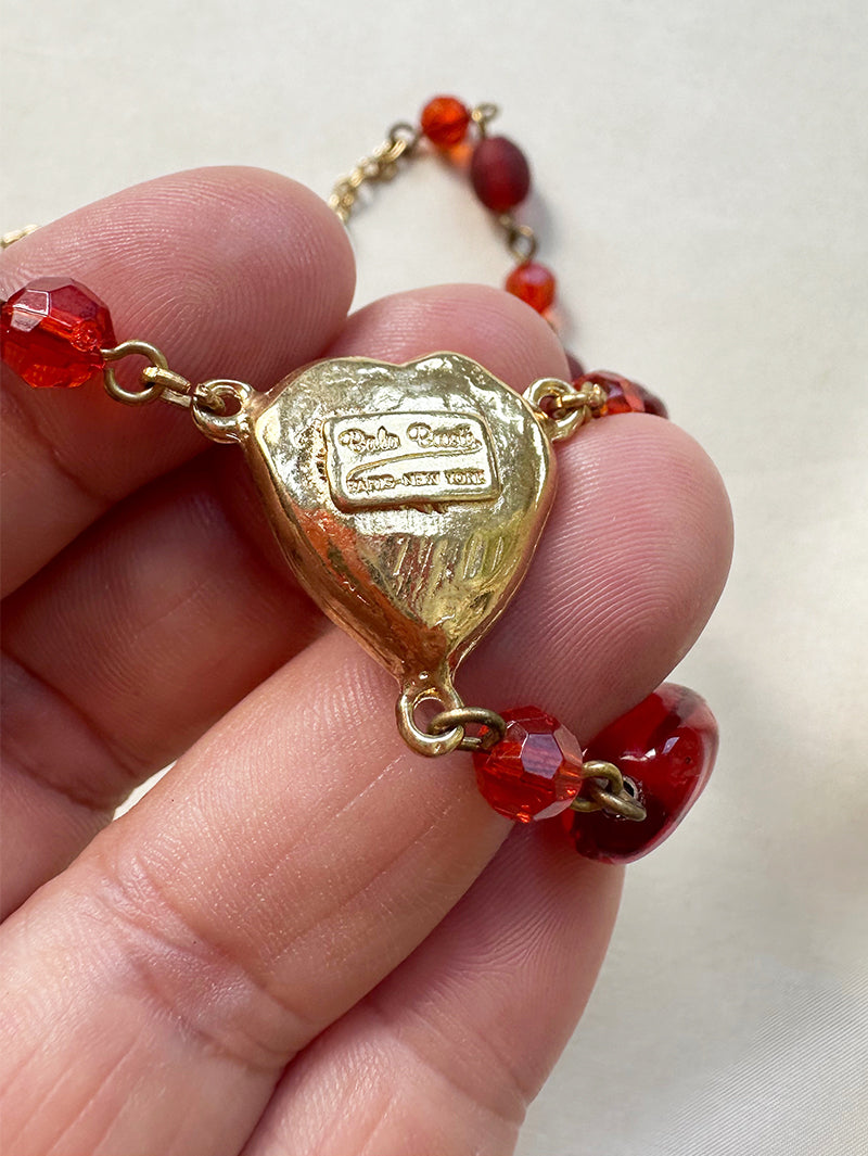 Designer collier met rode kralen en hartje