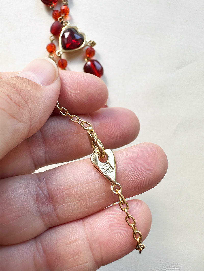 Designer collier met rode kralen en hartje
