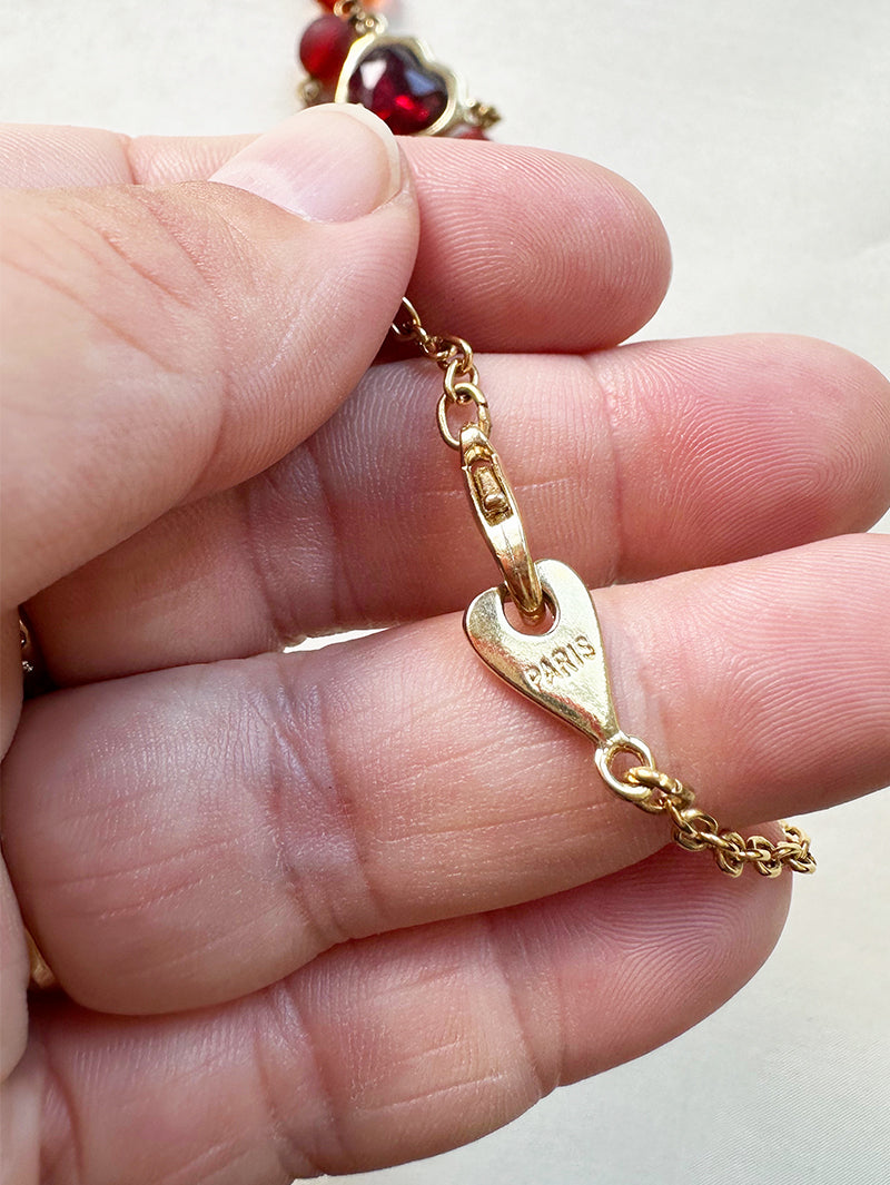 Designer collier met rode kralen en hartje