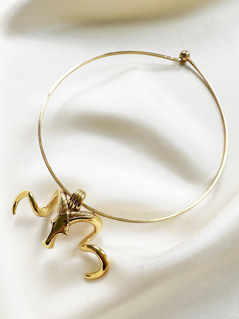 Vergulde ketting met ramhoofd