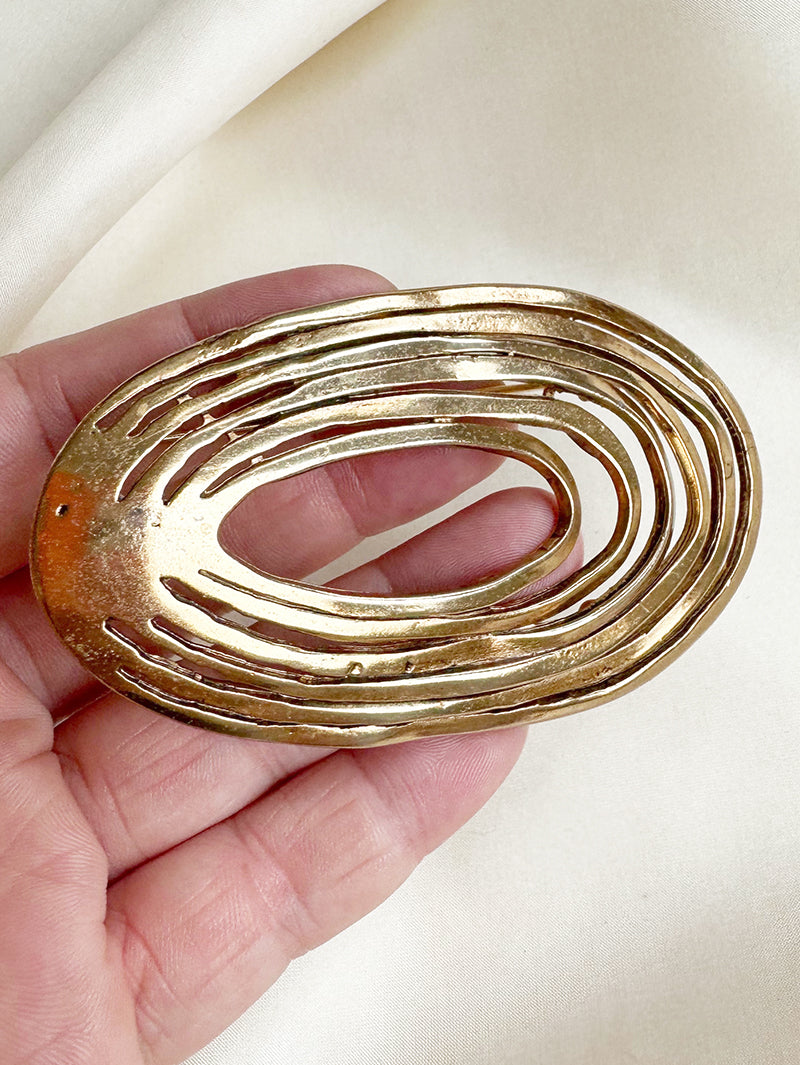 Grote vergulde designer broche