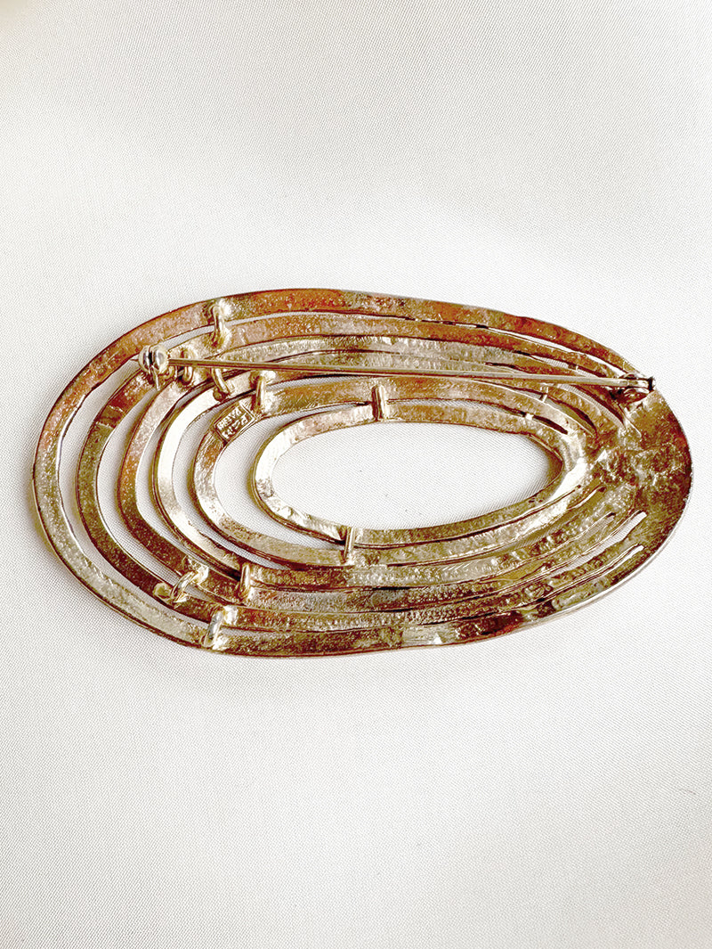 Grote vergulde designer broche