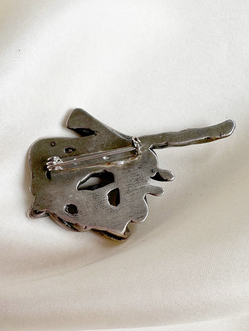 Verzilverde fantasie broche