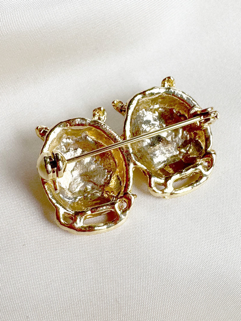 Vergulde uiltjes broche