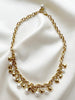 Gouden collier met bedels