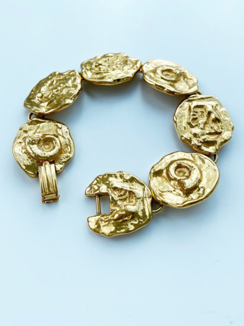 Vergulde schakelarmband met schelpjes