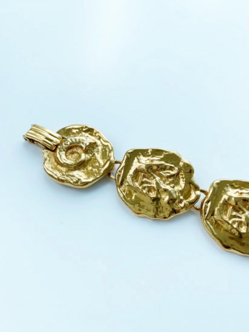 Vergulde schakelarmband met schelpjes