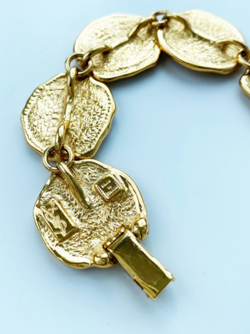 Vergulde schakelarmband met schelpjes