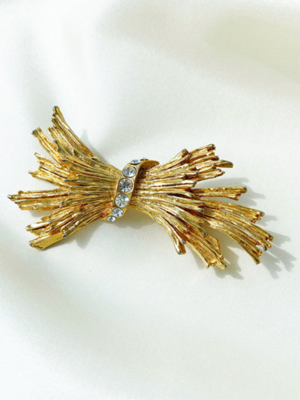 Vergulde fantasie broche met strass